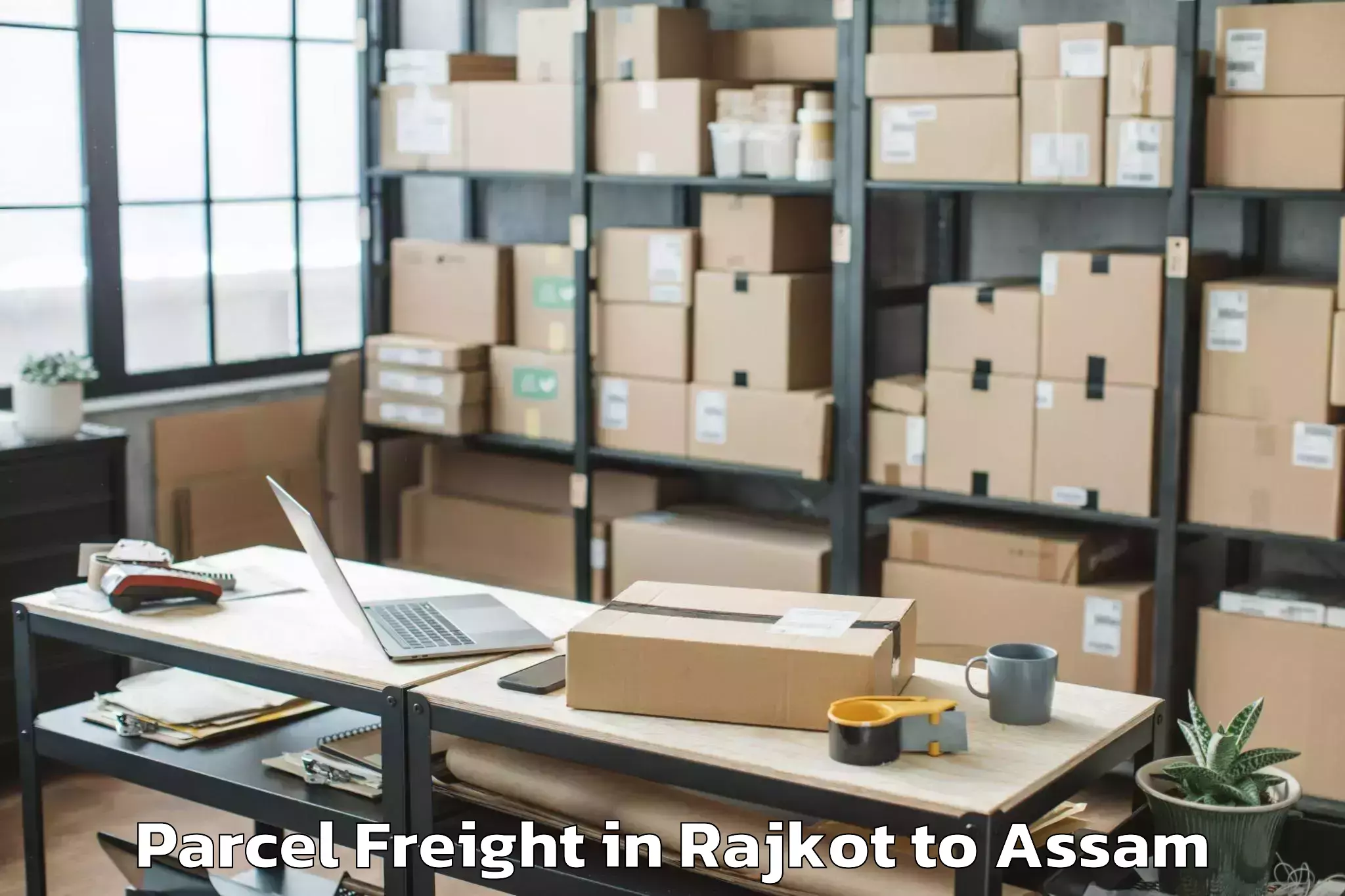 Quality Rajkot to Rajakhat Banekuchi Parcel Freight